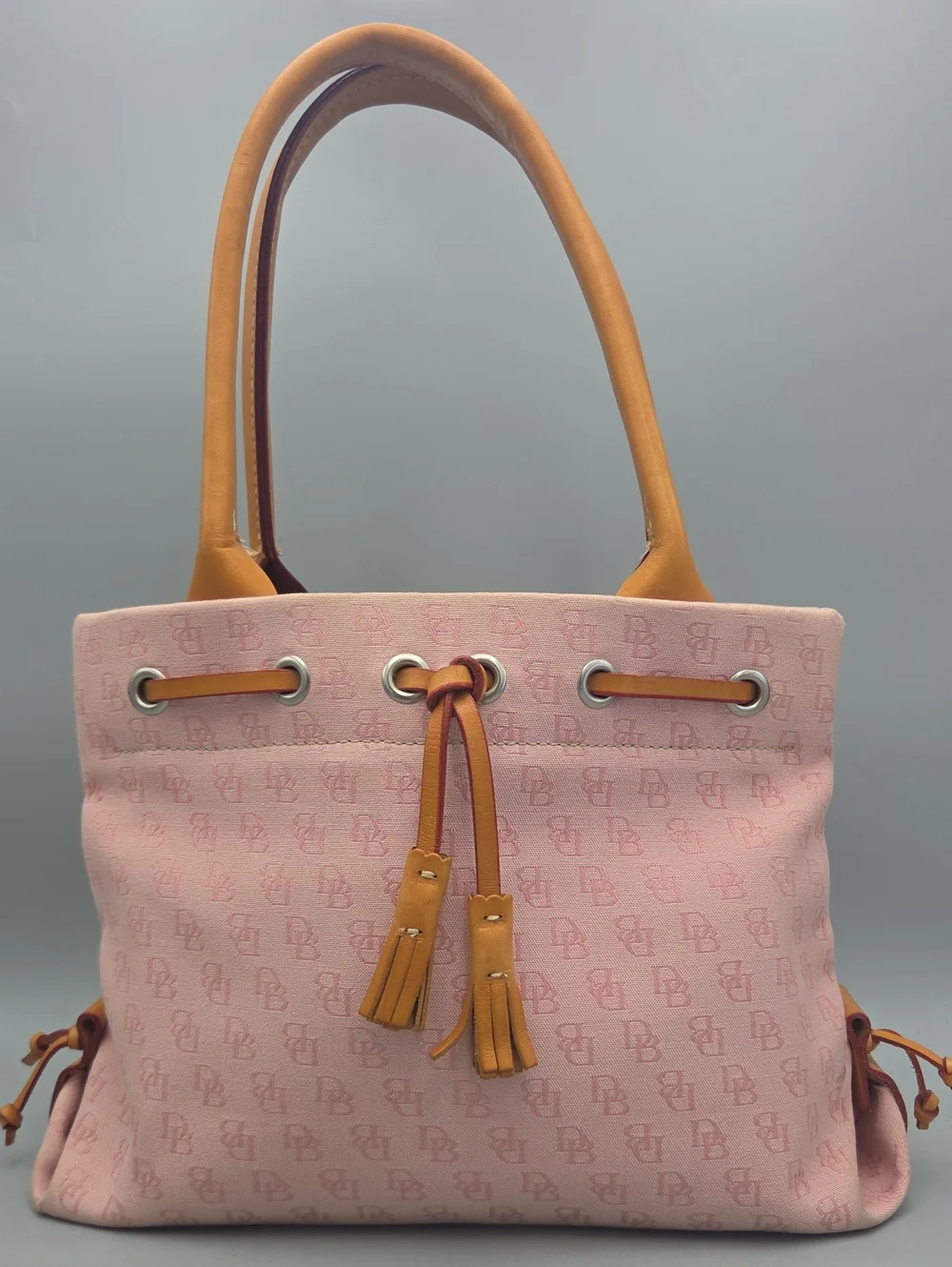 Dooney Bourke DB Monogram Drawstring Tote Canvas Leather Tassel Pink